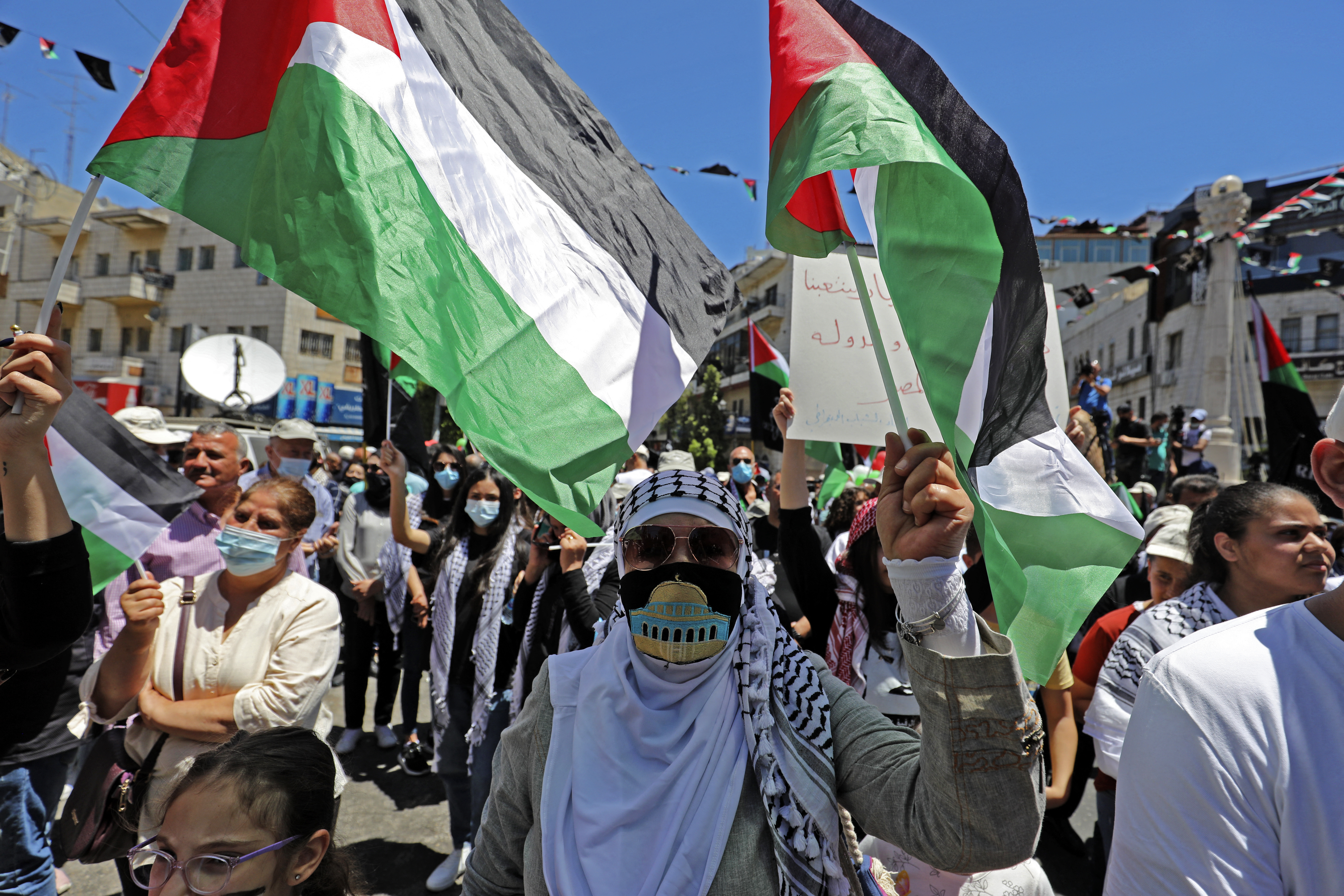 Palestinians protest in the occupied West Bank village of Salem on 15 May 2021 (AFP)