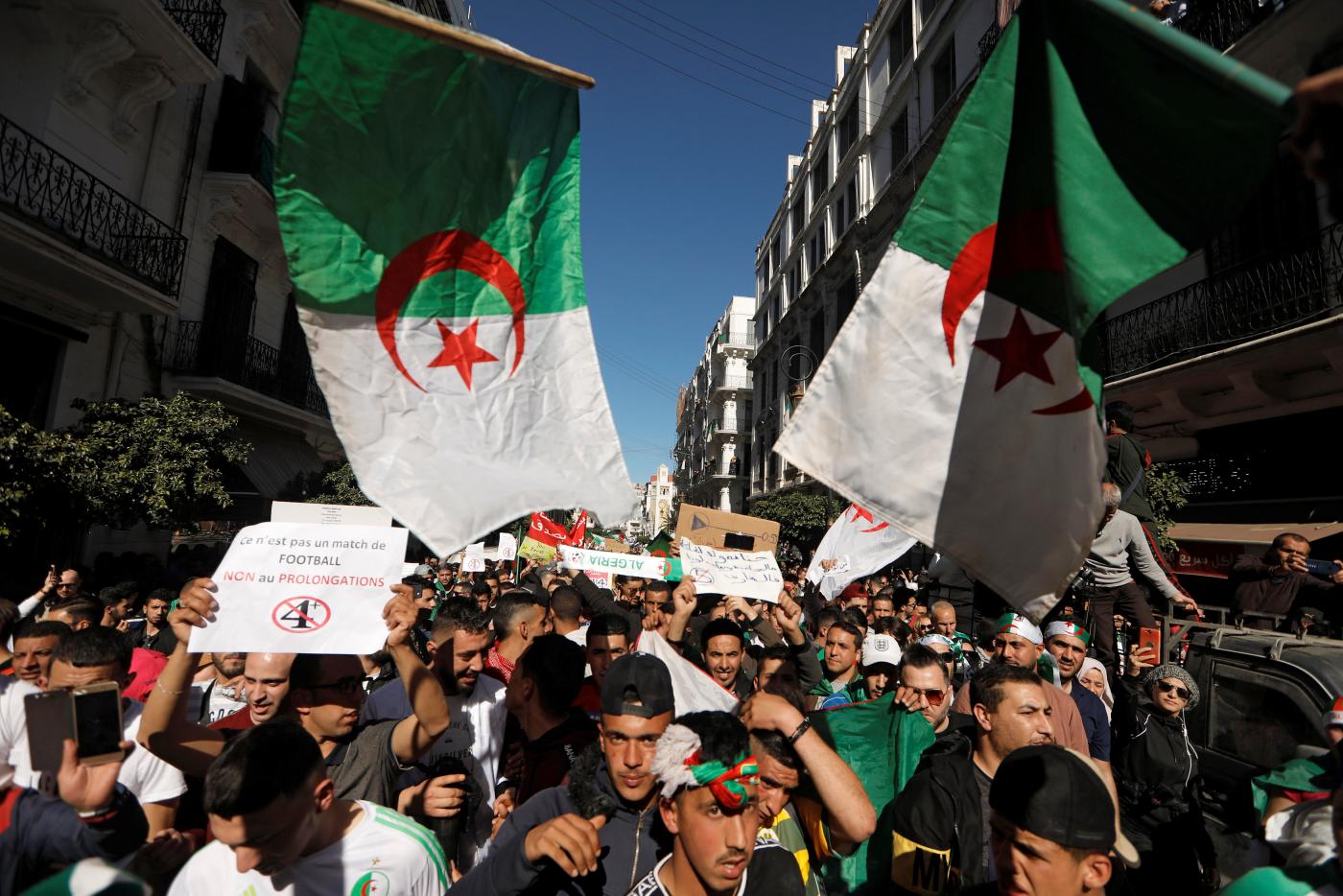 Thousands of people take part in anti-government protests in Algiers (AFP)