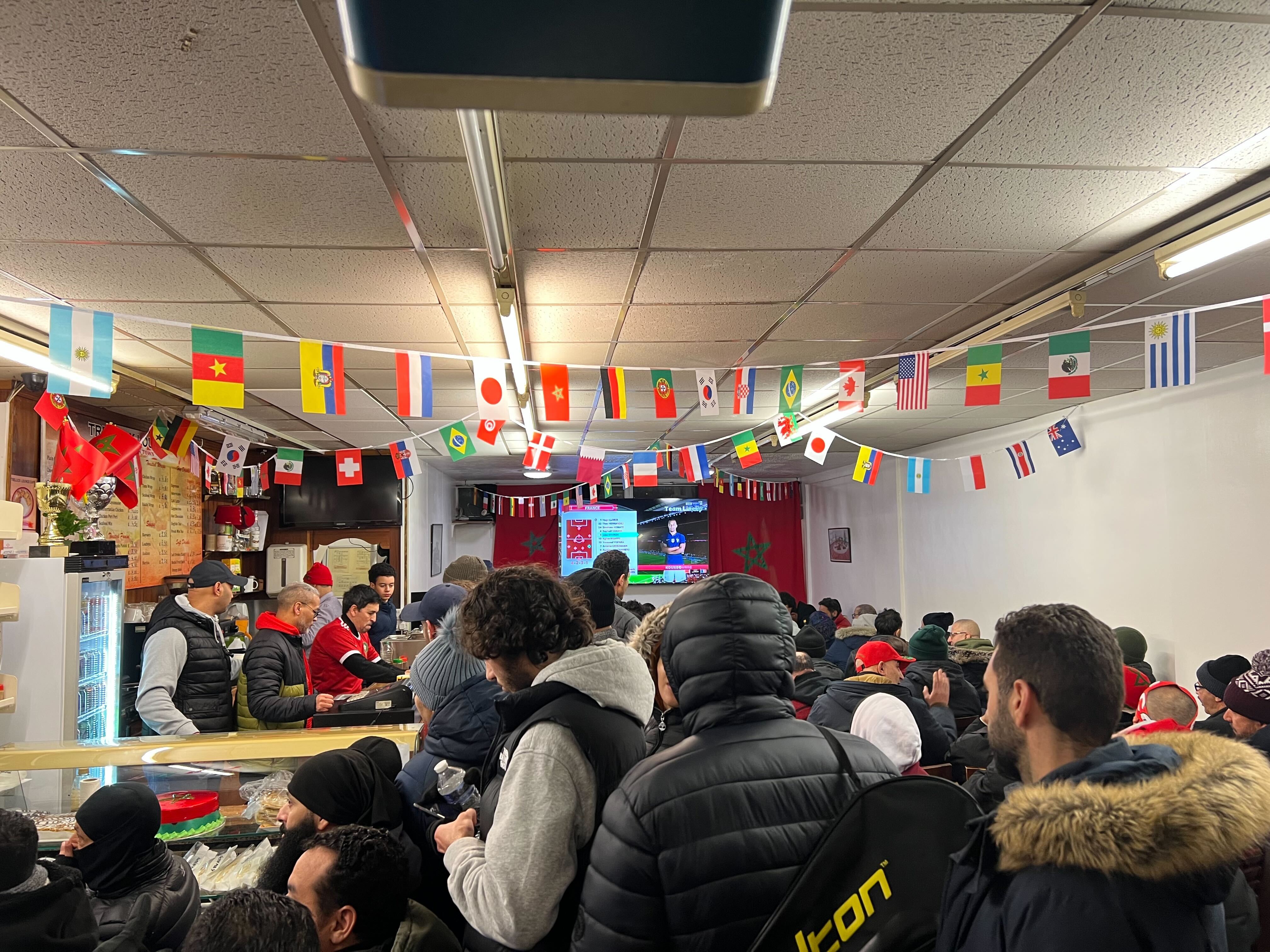 Crowds gathered inside the Trellick lounge as Moroccan fans geared up for the World Cup semi-final (MEE/Areeb Ullah)