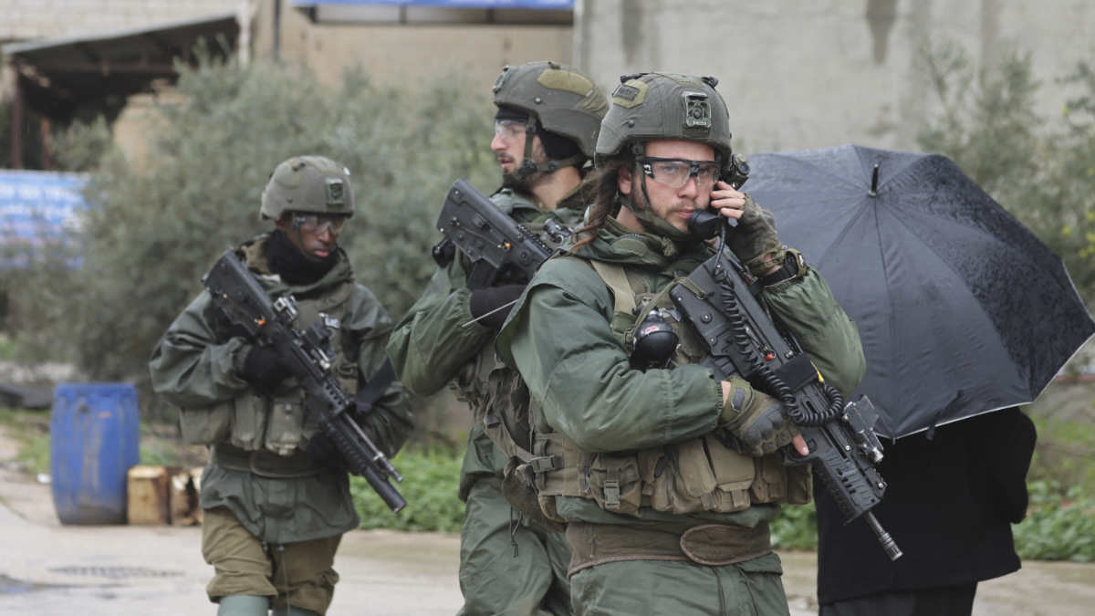  Israeli soldiers patrol Huwwara in the occupied West Bank a day after a shooting attack on an Israeli settler's car in the Palestinian town, on 30 March 2023.