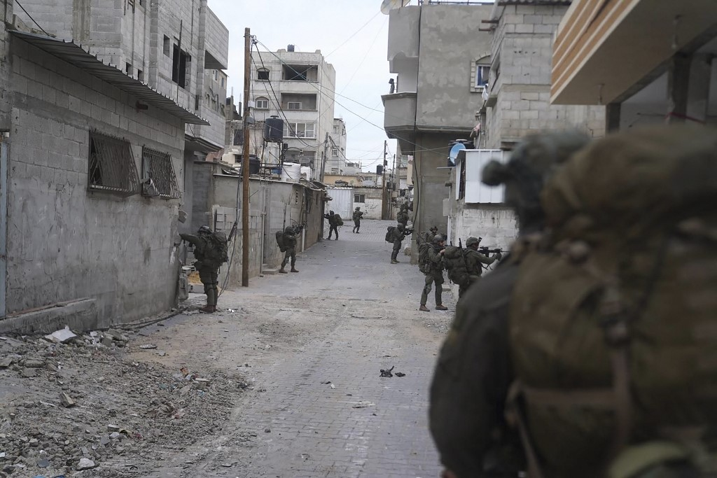 This handout picture released by the Israeli army on 16 February shows Israeli troops on the ground in the Gaza Strip amid a ground assault (AFP/Israeli Army)