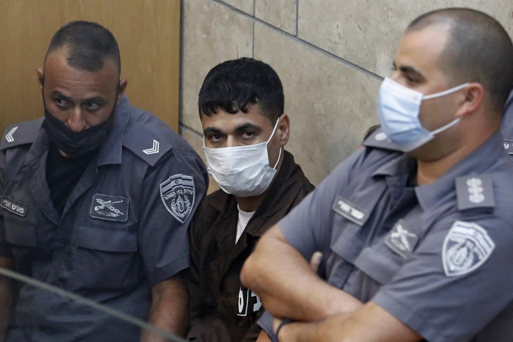Mahmoud al-Ardah, a Palestinian prisoner who directed and oversaw the plan to dig a tunnel and jailbreak from Gilboa, is seen sitting in an Israeli court in Nazareth, 11 September 2021 (AFP)