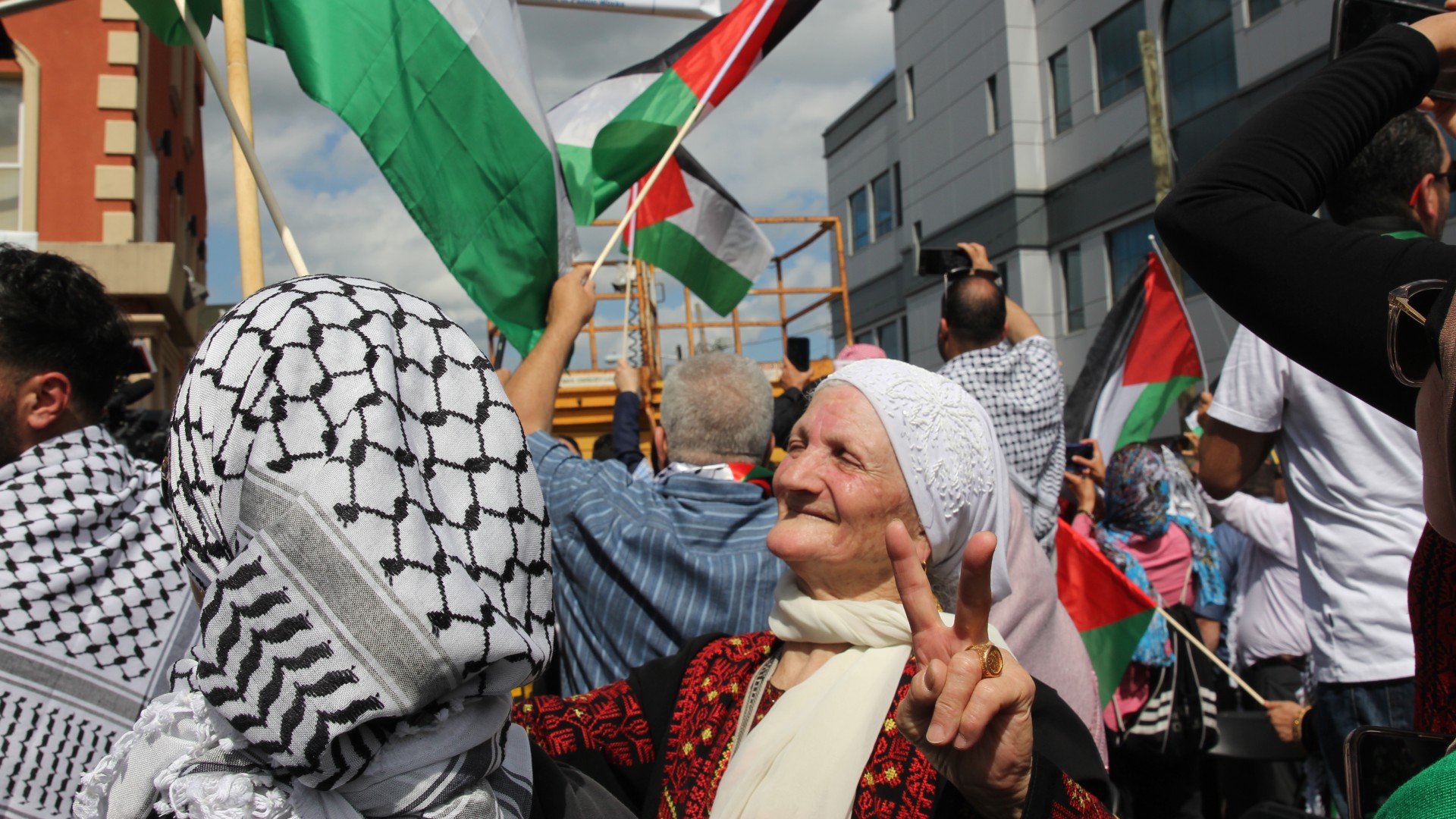 Palestinian women celebrate decision to rename a five-block area of 'Main Street' to 'Palestine Way' (MEE/Reem Farhat)