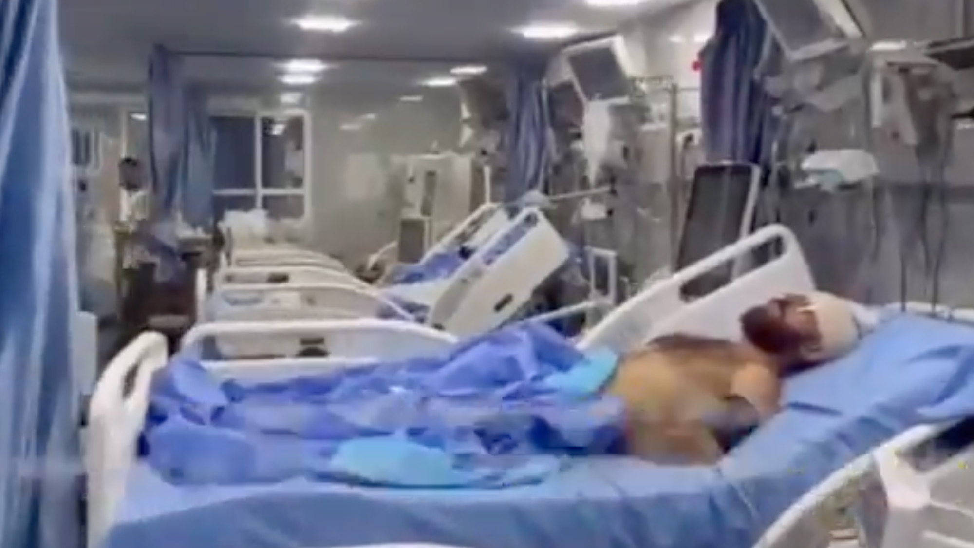 Patients inside Kamal Adwan hospital pictured in a video taken shortly after it was shelled on Friday (Screenshot/X)