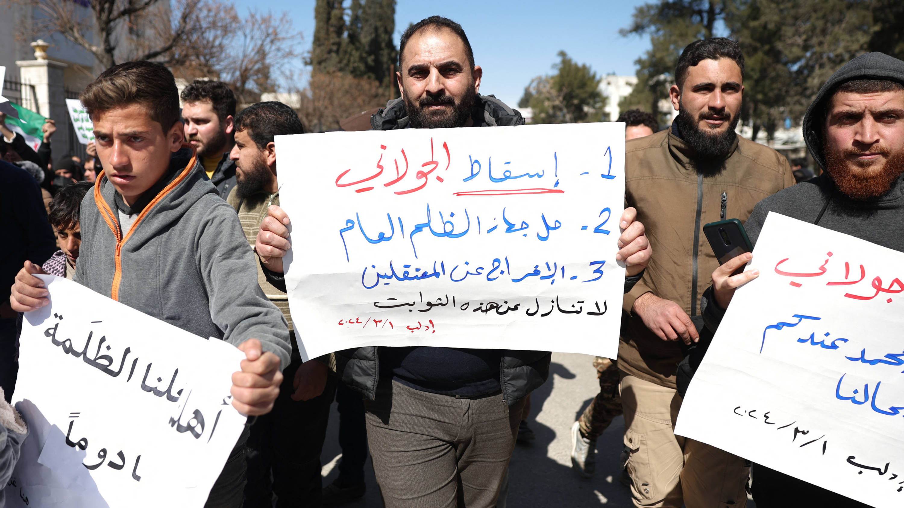 Protesters rally in the town of Idlib in Syria's northwestern Idlib province on 1 March 2024 against Hayat Tahrir al-Sham (AFP)