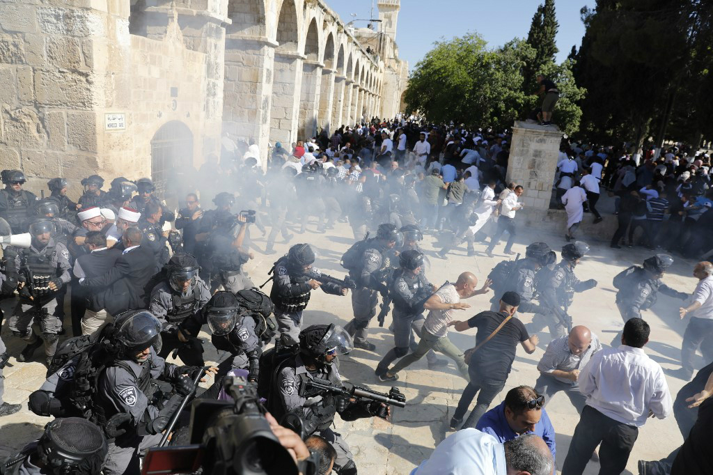 Israeli forces broke up the festival atmosphere inside Al-Aqsa as hundreds gathered for Eid prayers (AFP)