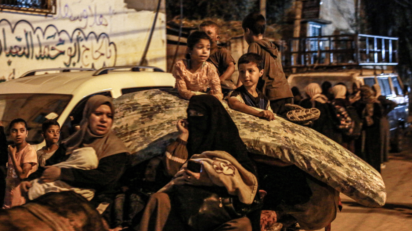 Displaced Palestinians flee the latest Israeli attacks on al-Bureij refugee camp in central Gaza on 4 June 2024 (Bashar Taleb/AFP)