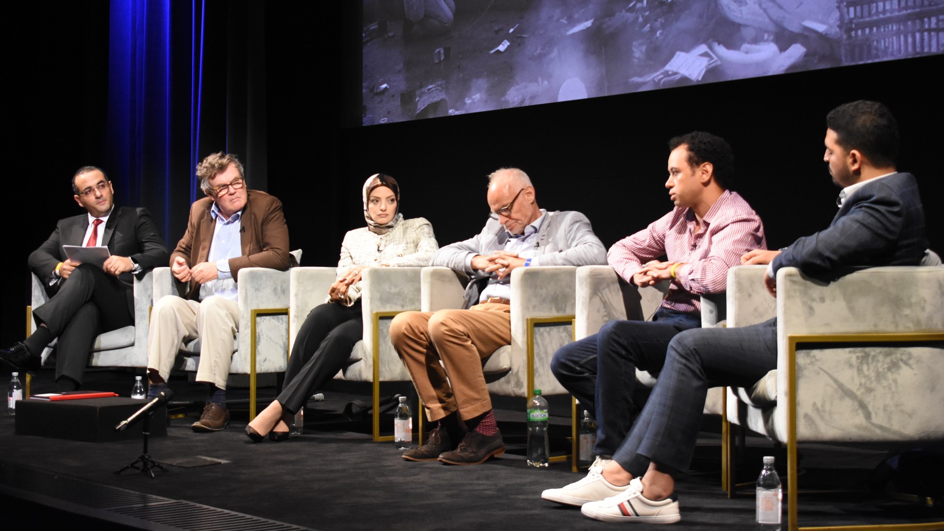 Panelists speak at the premiere of the documentary in London on 3 August 2023 (MEE/Mohammad Saleh)