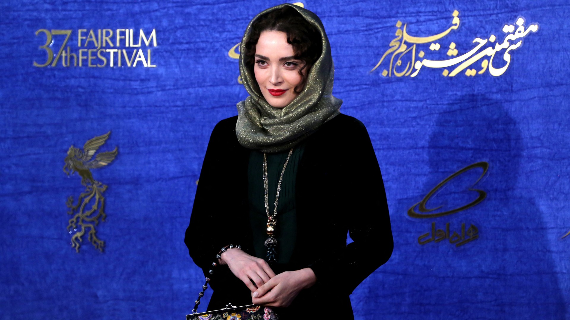 Iranian actor Behnoosh Tabatabaei poses for a photograph as she arrives for a film screening during the 37th edition of the Fajr Film Festival in Tehran on 10 February 2019 (AFP)