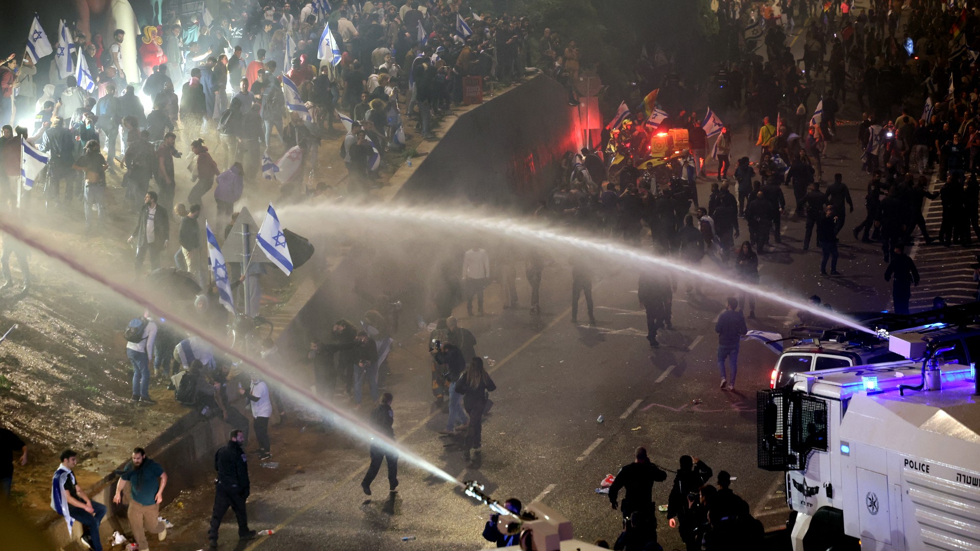 Protesters clash with the police during a rally against the Israeli government's judicial reform in Tel Aviv (AFP)