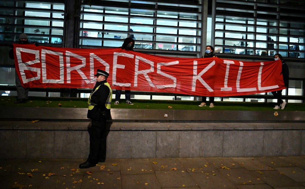 Protesters in London denounce Britain’s border policies on 25 November 2021 (AFP)