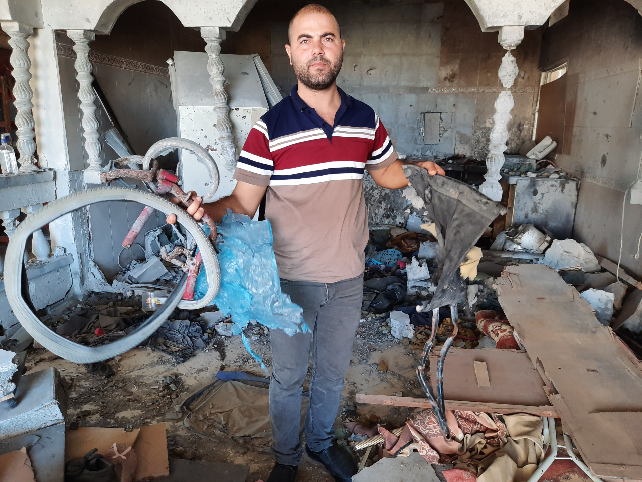 Describing the killing of his brother Iyad Salha, Omar said 'this attack was a dirty operation against a civilian disabled man sitting on his wheelchair' (MEE/Ahmed Al Sammak)