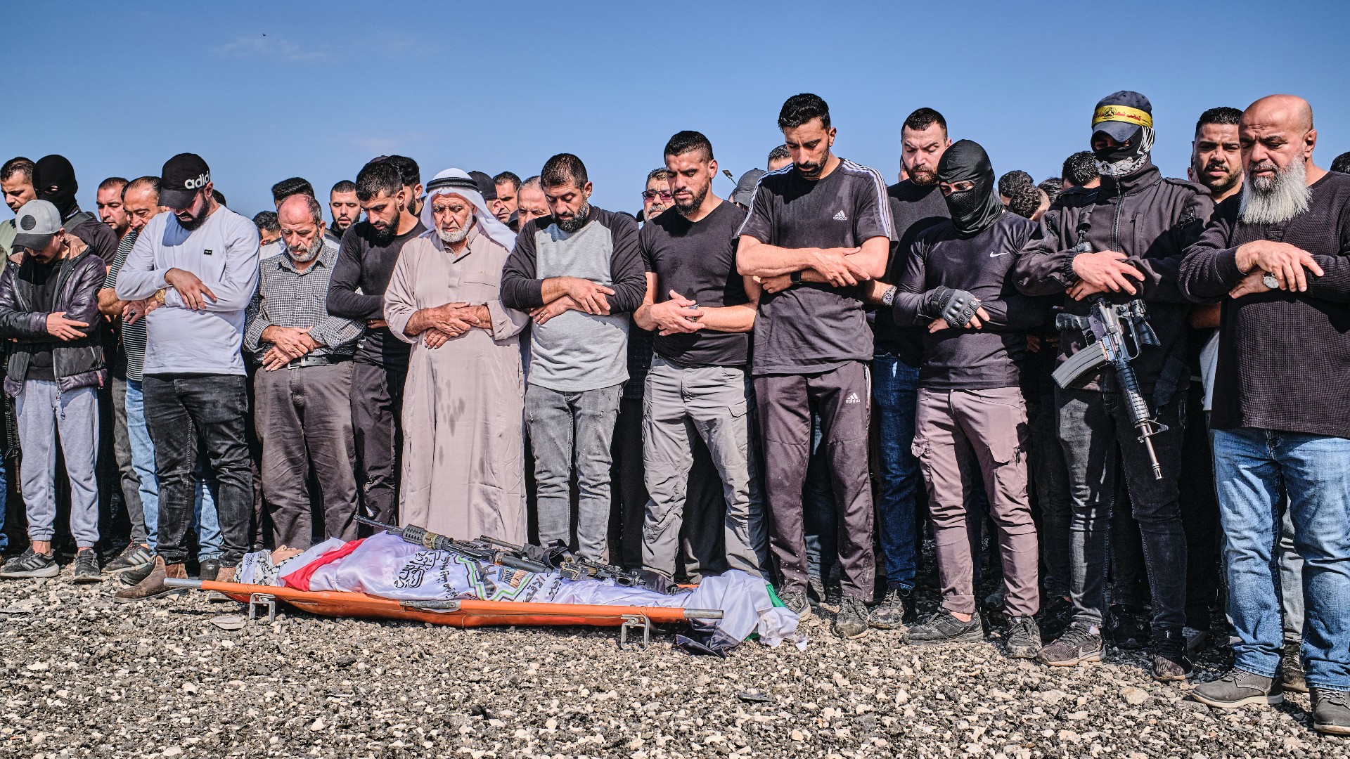 Palestinians perform funeral prayers for Jamal Mashaqa who died from injuries sustained in an Israeli air strike (MEE/Angelo Calianno)