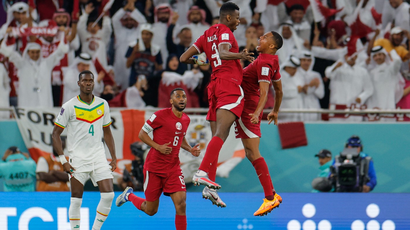 Qatar players celebrate after scoring their first goal in the World Cup.