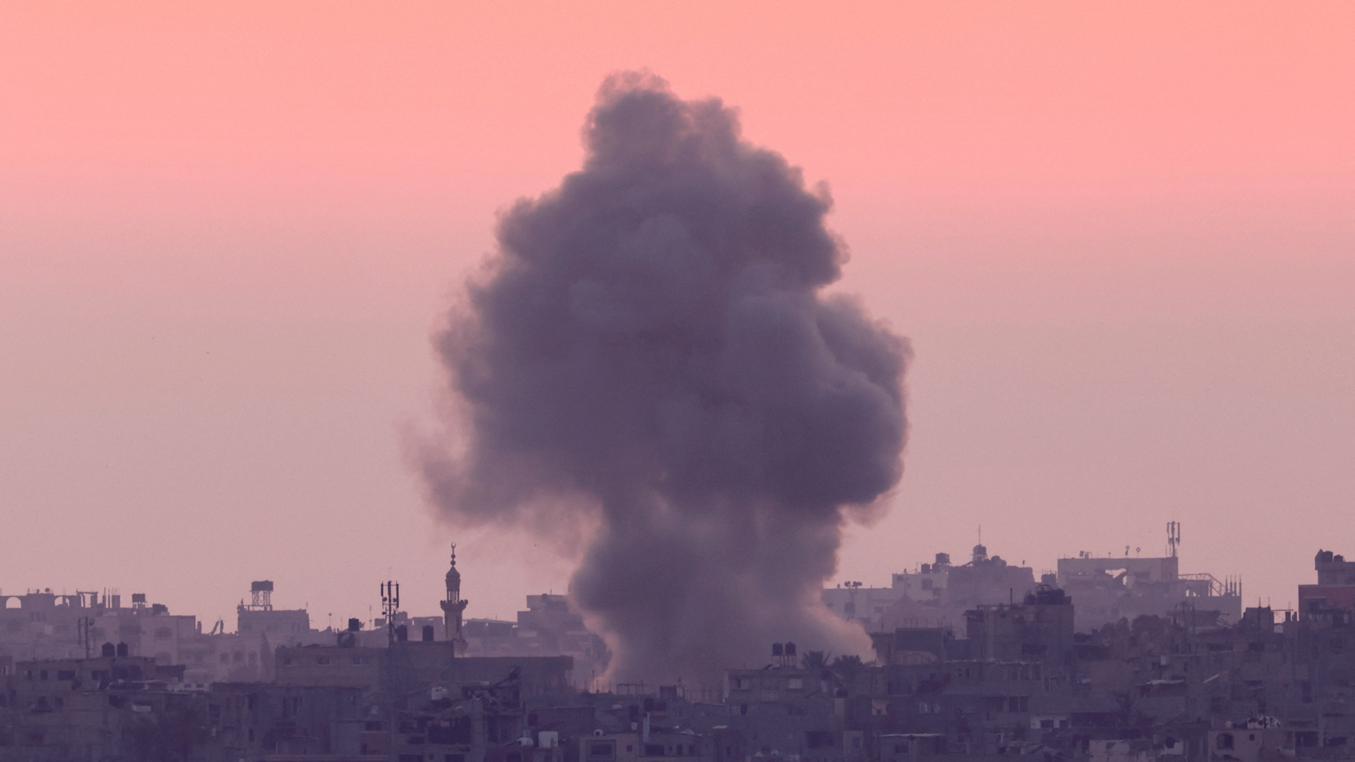 Smoke rises after an Israeli strike on the Gaza Strip on 5 June 2024, as seen from Israel (Reuters/Amir Cohen)