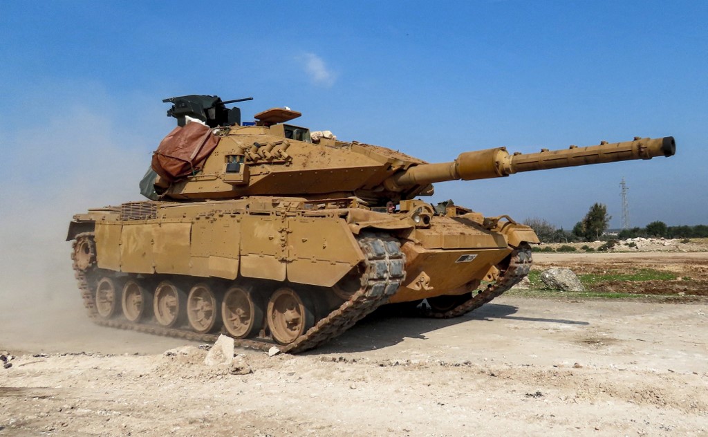 A Turkish tank is seen along the M4 highway in northern Syria in March 2020 (AFP)