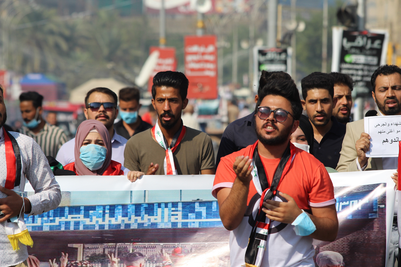 Colleagues of Safaa al-Sarray march along Saadoun Street (Alex MacDonald)