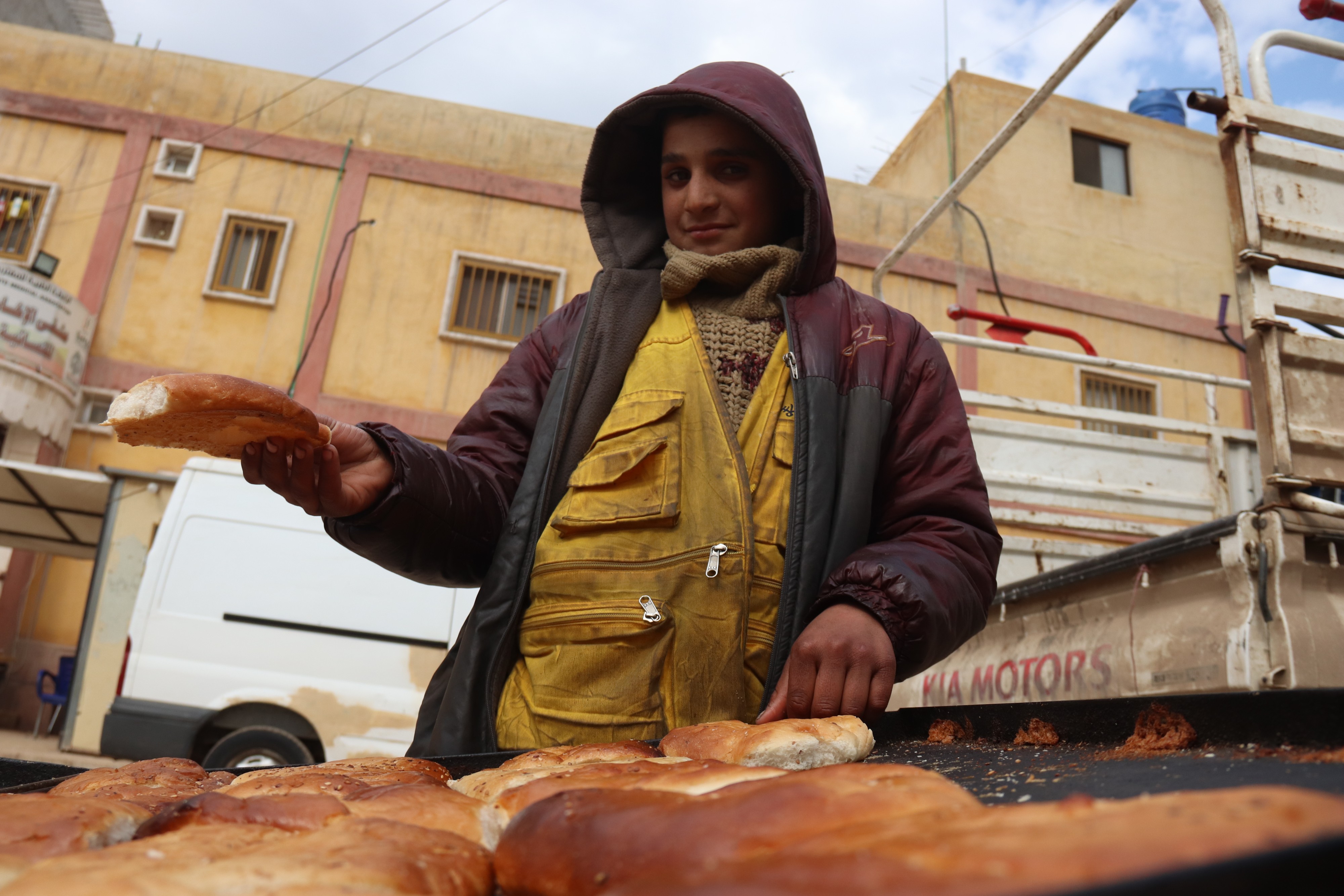 Muhammad, 14, would love to be an architect someday. For now, he sells pastries as his family's only earner (MEE/Muhammad Al Hosse)
