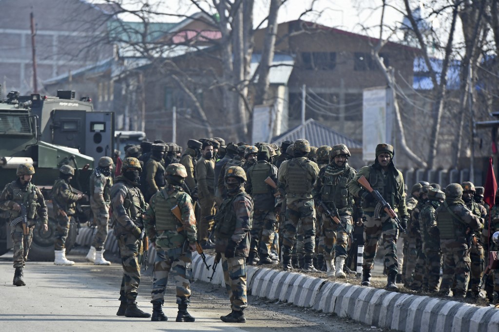 Indian soldiers are pictured on the outskirts of Srinagar on 30 December 2020 (AFP)