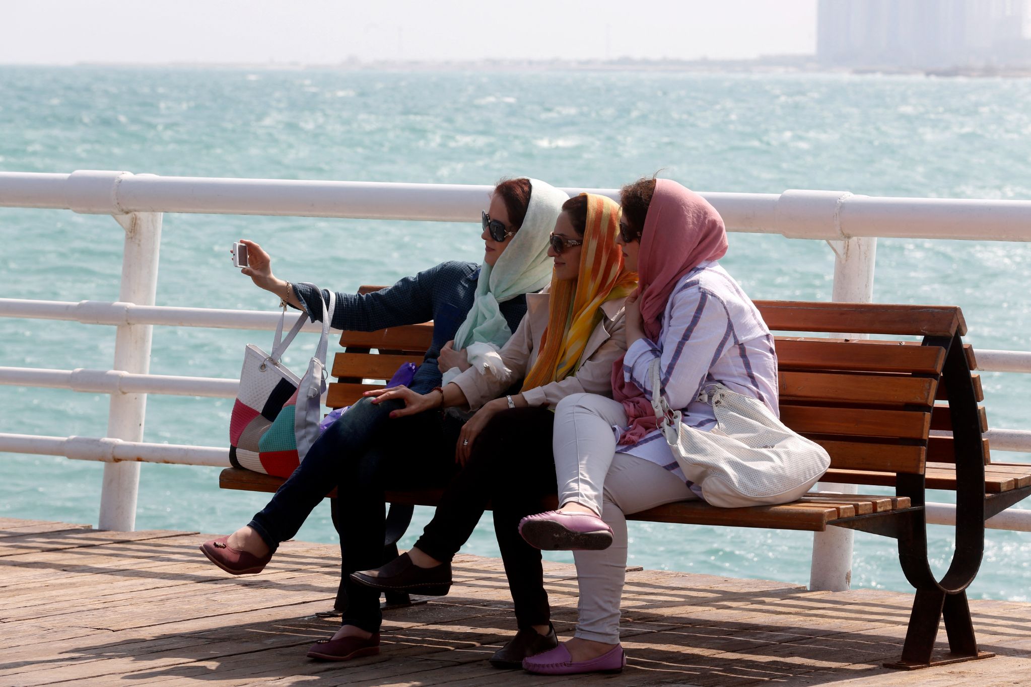 ranian women take a selfie on the sea front in Iran's southern resort island of Kish in November 2016 (Atta Kenare/AFP)