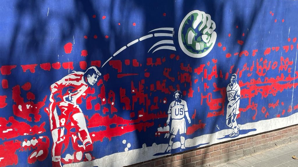 A mural on the wall of the former US embassy in Tehran, showing Iran's goal against the US at the 1998 World Cup (MEE)