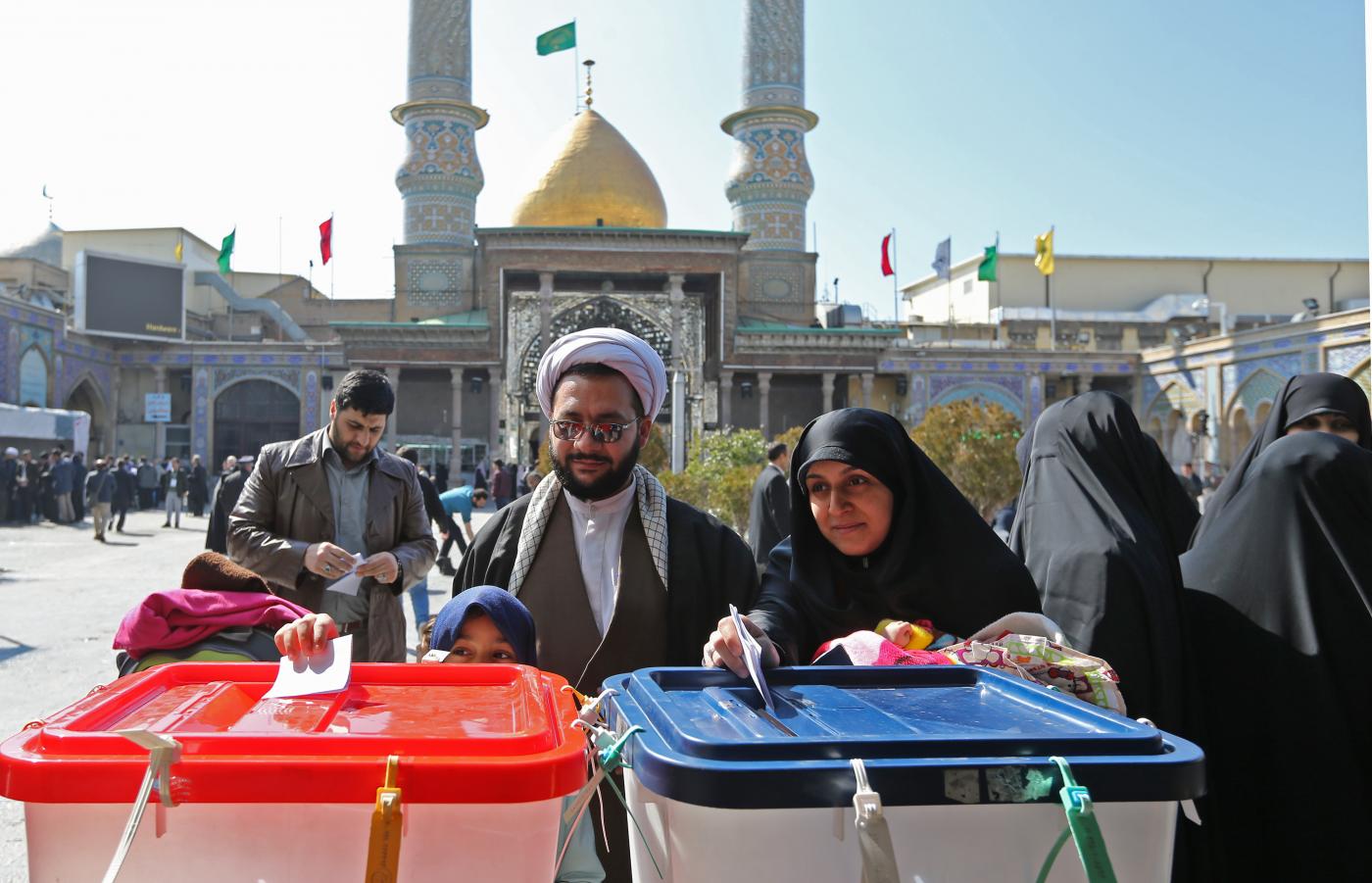 Iranians cast their votes during parliamentary elections at the Shah Abdul Azim shrine on the southern outskirts of Tehran on February 21, 2020. (AFP)