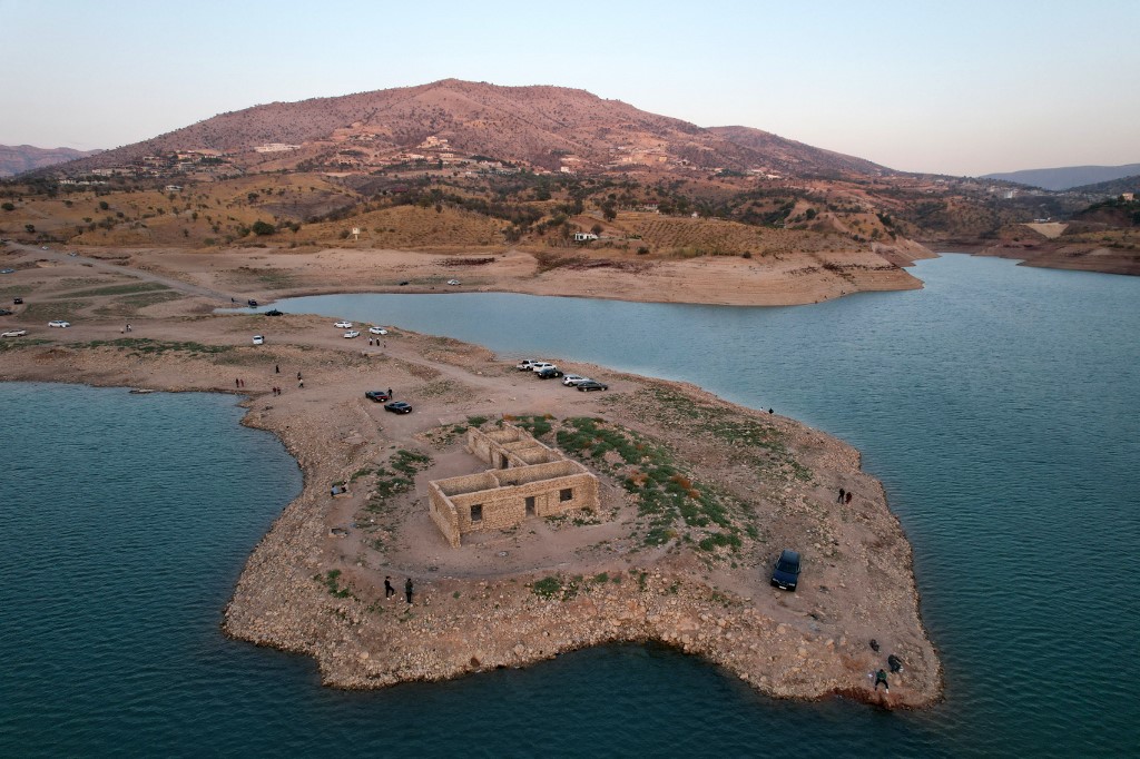 The remains of a submerged village abandoned decades ago, seen on 4 November 2021, resurfaced after a large drop in the water level of Iraq’s Dohuk Dam due to drought (AFP)