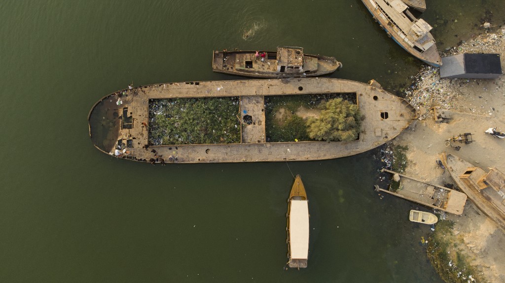 An aerial picture shows dilapidated vessels in the Shatt al-Arab waterway in Iraq’s southern city of Basra on 9 October 2022 (AFP)
