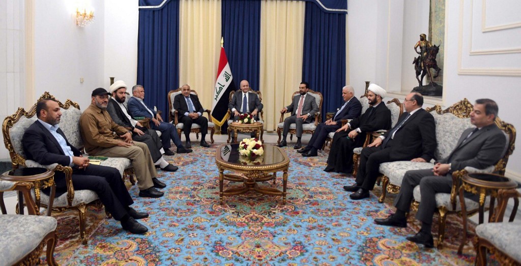 Iraqi officials and PMU leaders meet in Baghdad in August 2019 after an Israeli strike (Handout/Iraqi President’s Press Office/AFP)