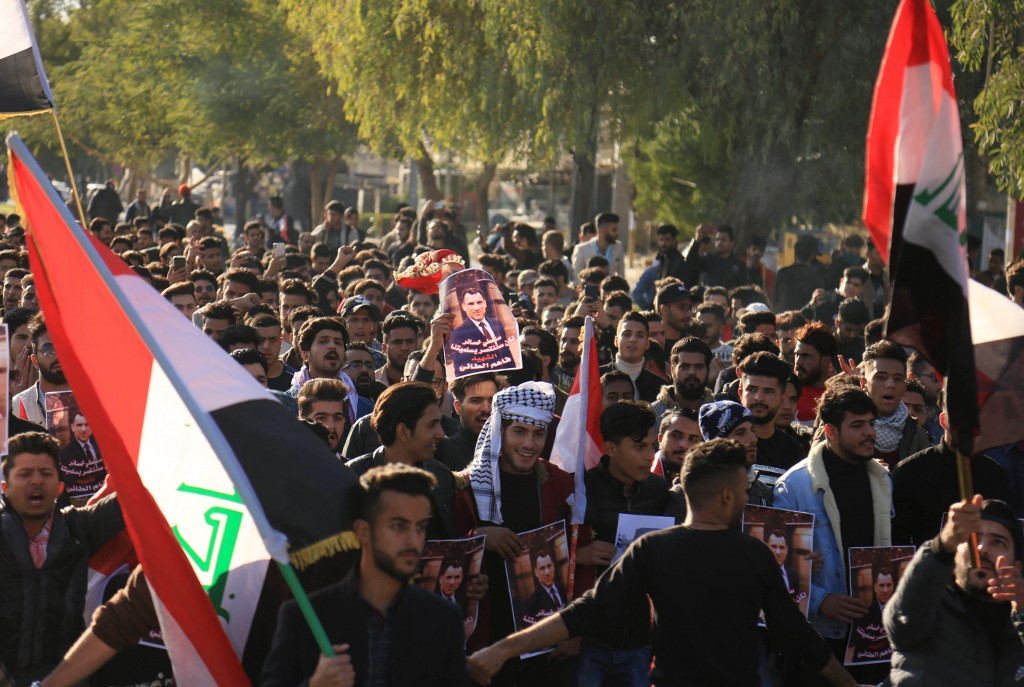 Iraqi anti-government demonstrators protest in Karbala on 10 January (AFP)
