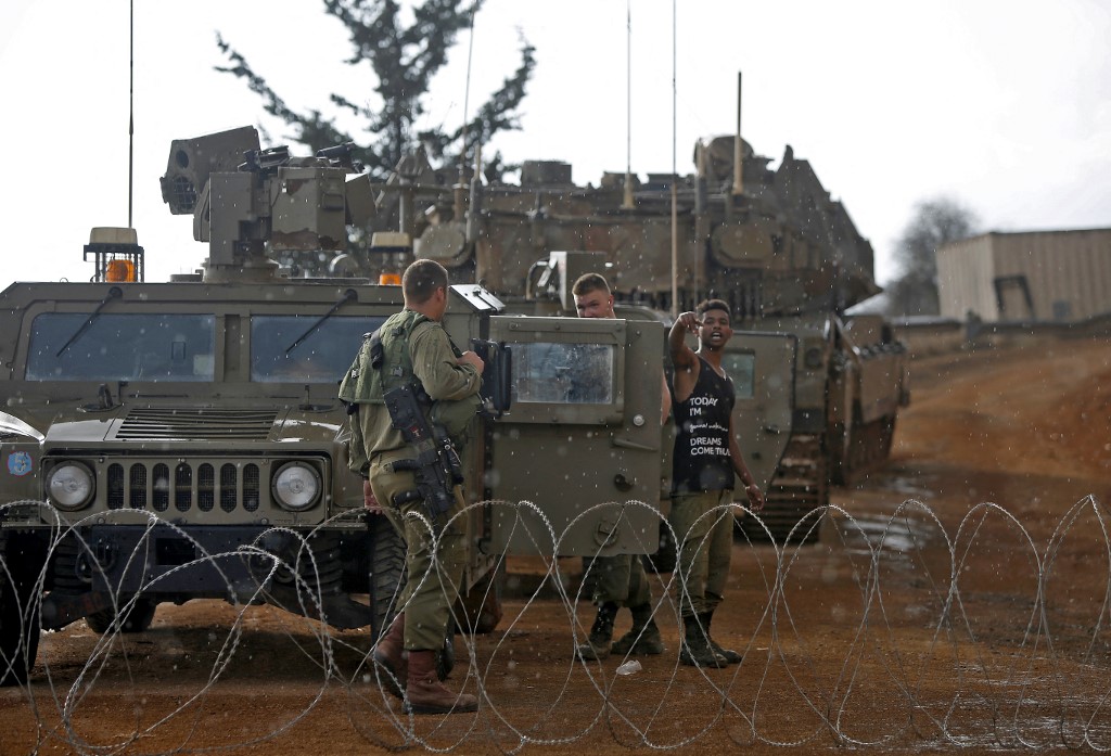 Israeli soldiers stand near the Lebanese border in November 2020 (AFP)