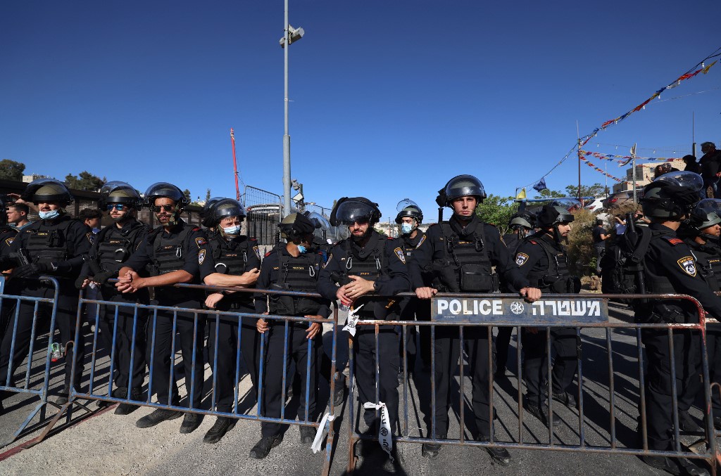 Israeli police gather in the Sheikh Jarrah neighbourhood on 7 May 2021 (AFP)