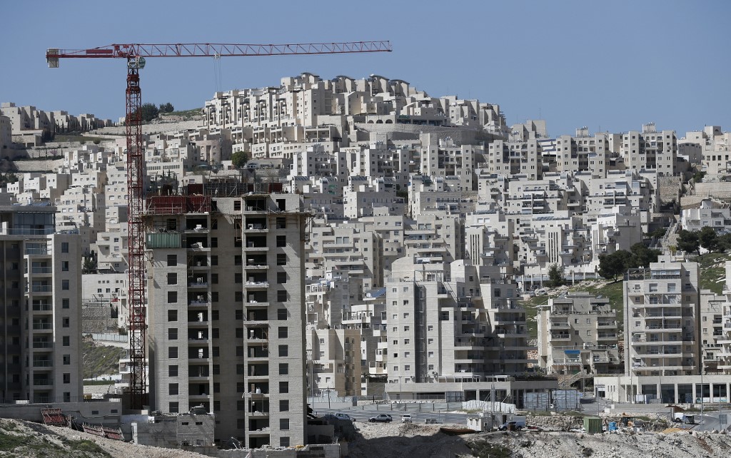Buildings under construction are pictured in the Israeli settlement of Har Homa in occupied East Jerusalem in 2016 (AFP)