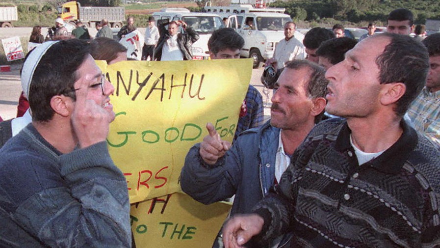 Itamar Ben-Gvir (L) disputes with Palestinians outside the Israeli Tel Mond prison 11 February 1997. 