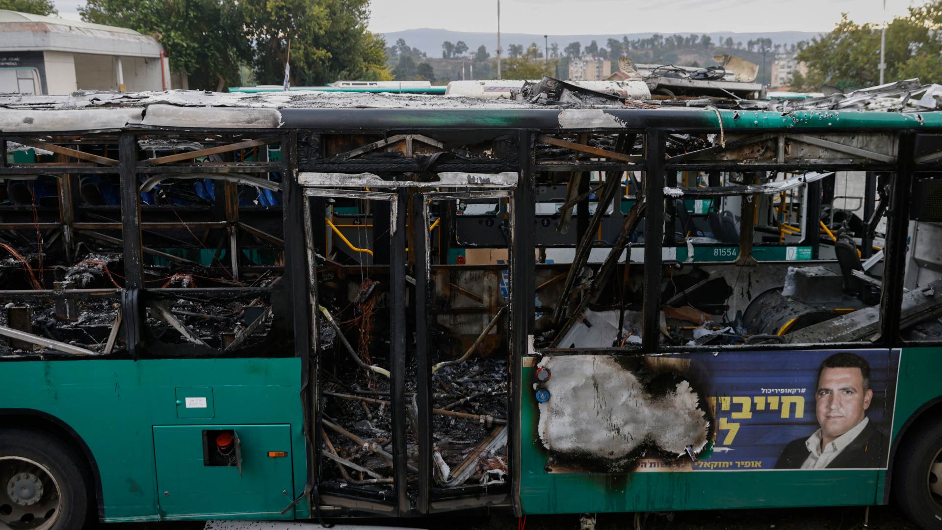 Damaged buses in the northern Israeli town of Kiryat Shmona following an overnight Hezbollah rocket attack on Wednesday (Jalaa MareyAFP)