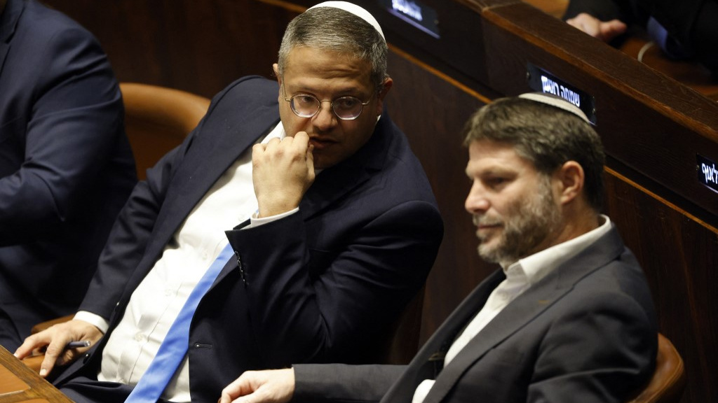 Israeli Knesset members Itamar Ben Gvir and Bezalel Smotrich attend a special parliamentary session in Jerusalem on 29 December 2022 (Amir Cohen/Pool/AFP)
