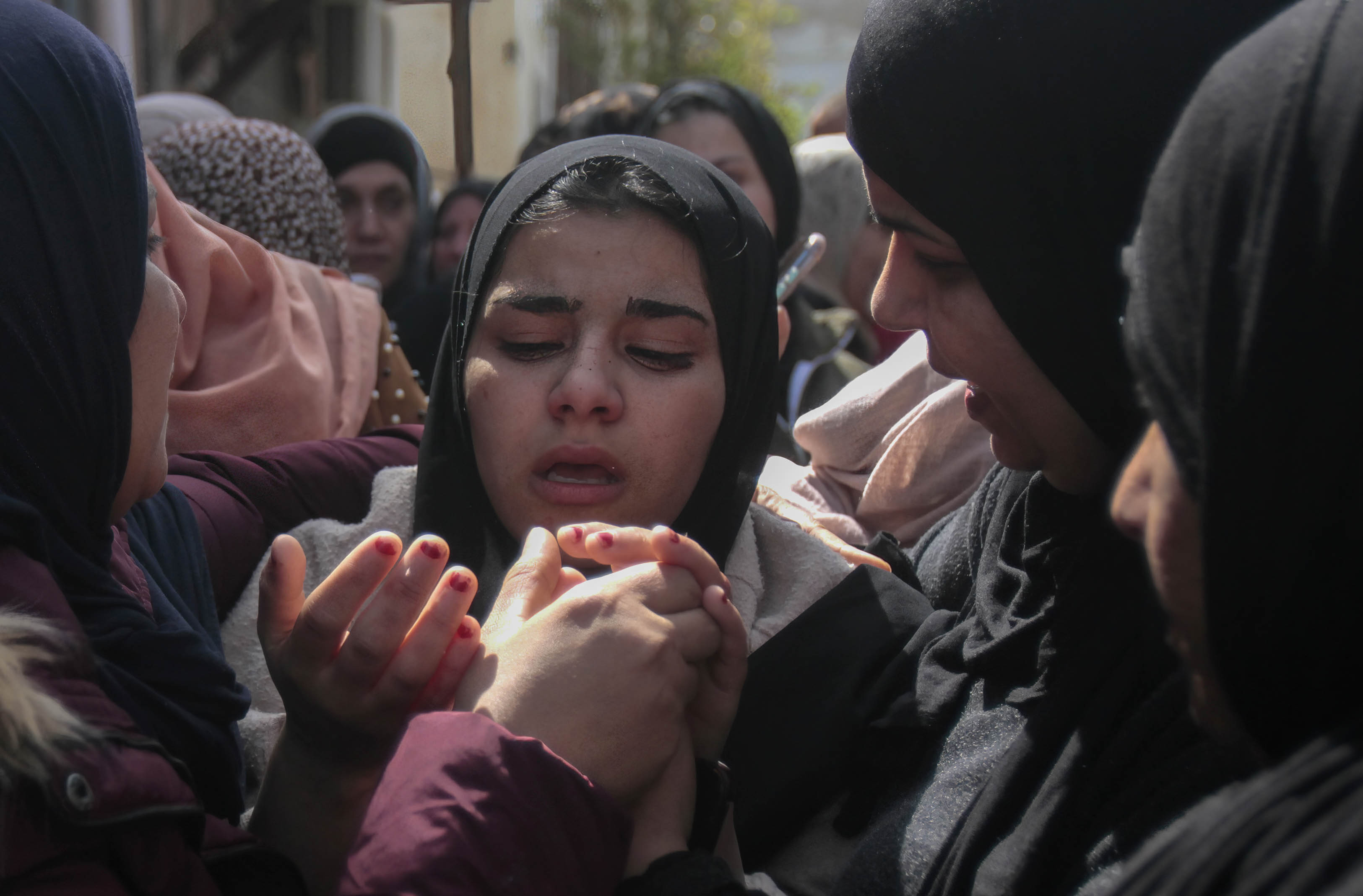 Sanad's sister Hadeel Abu Attia, 15, mourn her him during the funeral. (Reuters)