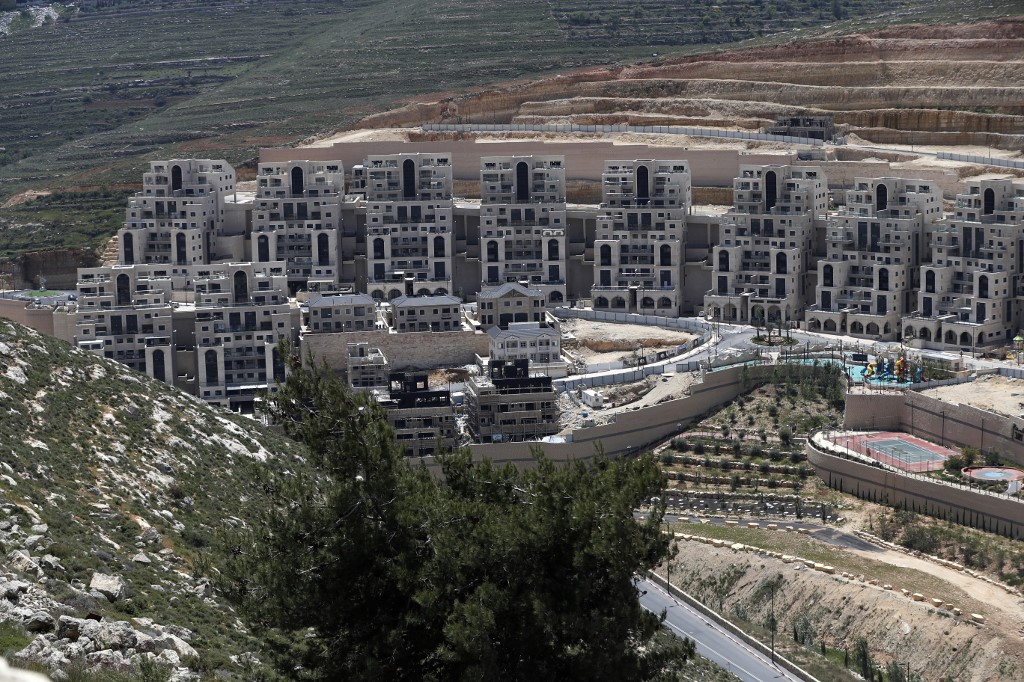 Construction takes place in the Israeli settlement of Givat Zeev on 19 April (AFP)