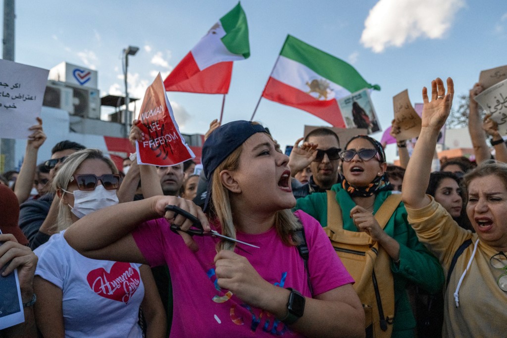 Protesters rally in support of Iranian women in Istanbul, Turkey, on 2 October 2022 (AFP)