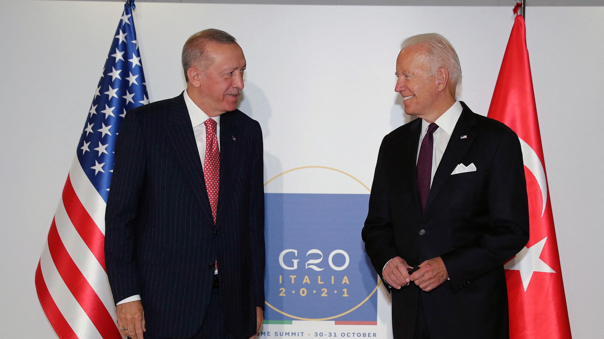 US President Joe Biden speaks with Turkish President Recep Tayyip Erdogan during the G20 Summit at the Roma Convention Center La Nuvola on 31 October, 2021 (AFP)