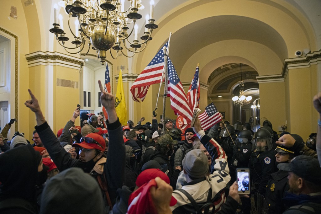 Trump supporters storm the Capitol building in Washington on 6 January 2021 (AFP)