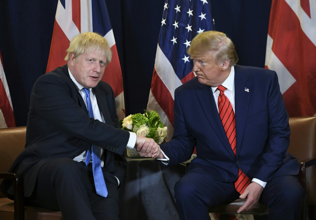 US President Donald Trump and British Prime Minister Boris Johnson meet in New York on 24 September (AFP)