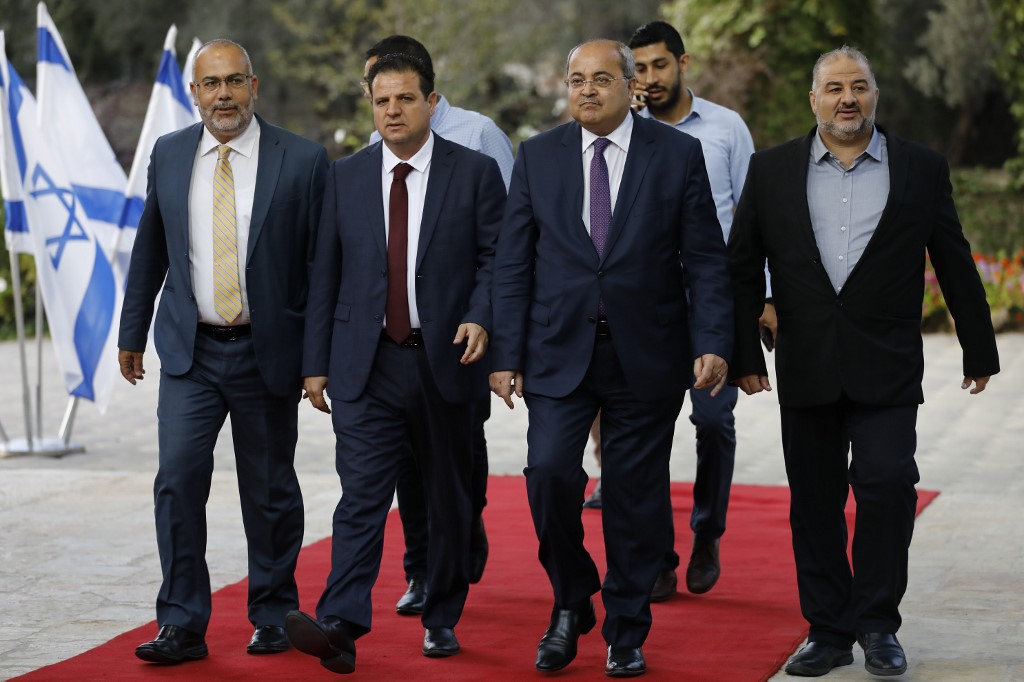 Joint List members arrive to meet Israel’s president in Jerusalem on 22 September (AFP)
