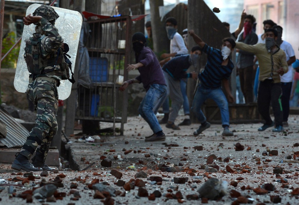 Indian security forces fire pellet guns towards Kashmiri protesters in 2016 (AFP)
