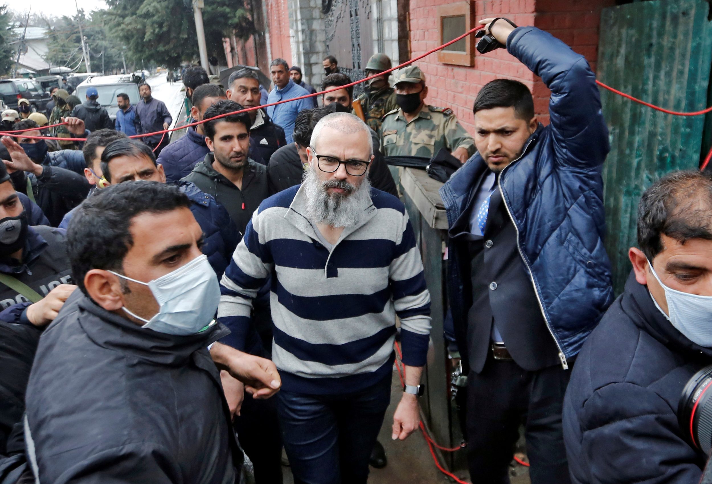 Omar Abdullah, former chief minister of Jammu and Kashmir, walks outside his residence following his release in Srinagar on 24 March 2020. He had been detained by Indian forces since August (Reuters)