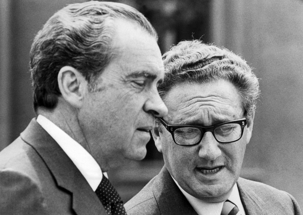 Kissinger speaks with then-US President Richard Nixon in Salzburg, Austria, in 1972 (AFP)