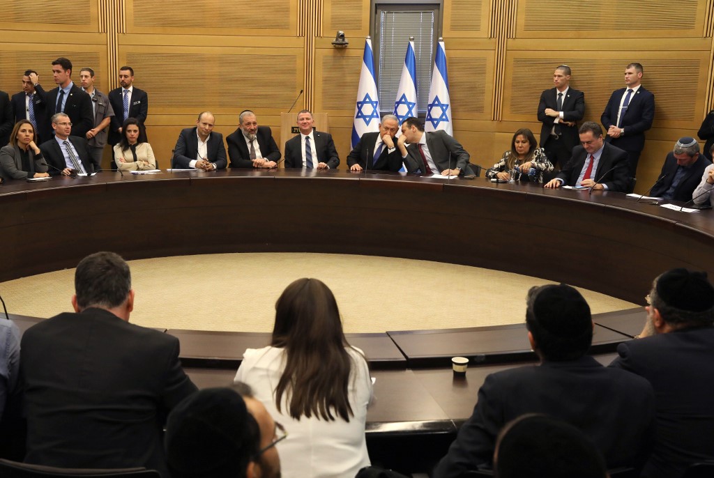 Netanyahu attends a meeting of the right-wing bloc at the Knesset in Jerusalem on 20 November (AFP)