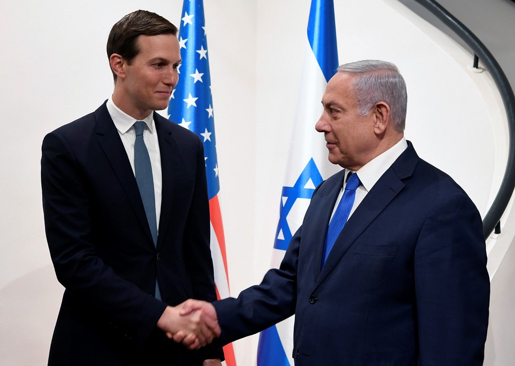 Israeli Prime Minister Benjamin Netanyahu shakes hands with US presidential adviser Jared Kushner in Jerusalem on 30 May (Matty Stern/US Embassy Jerusalem/AFP)
