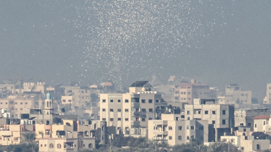Leaflets being dropped by the Israeli army over Gaza City telling people to evacuate the area on 16 November 2023 (Jack Guez/AFP)