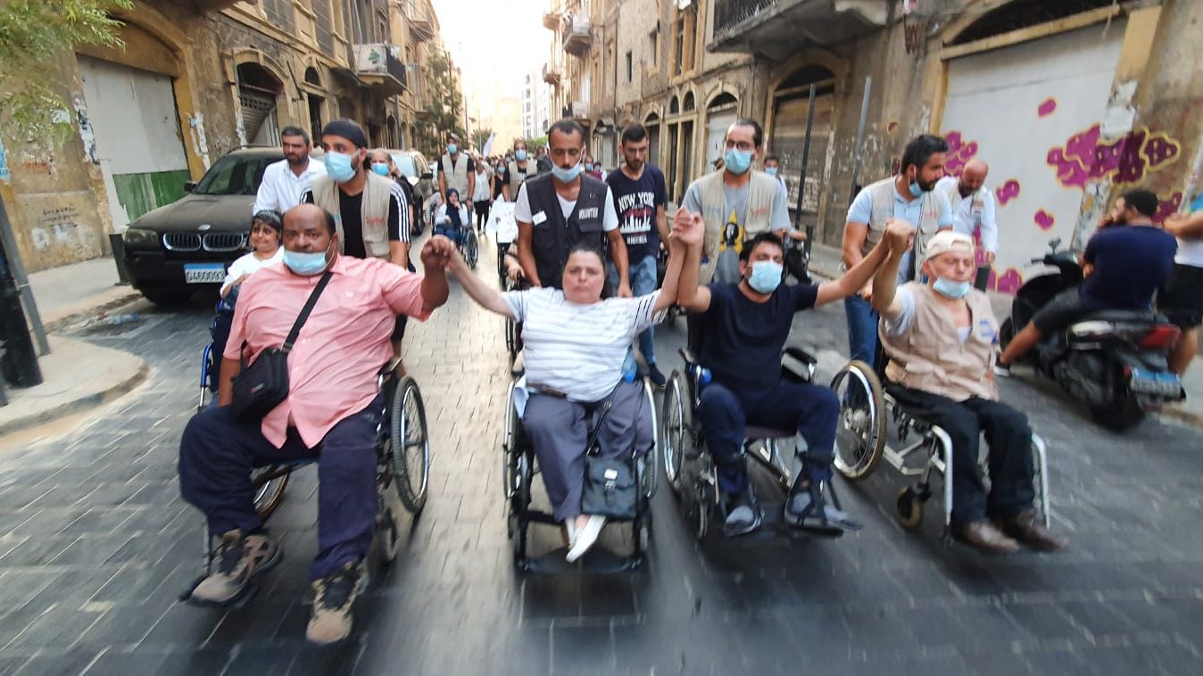 Survivors of the Beirut explosion, including Sylvana Lakkis (second from left) and Abbas Mazloum (third from left), protest in the Lebanese capital on 8 August 2021 (Handout/Sylvana Lakkis)